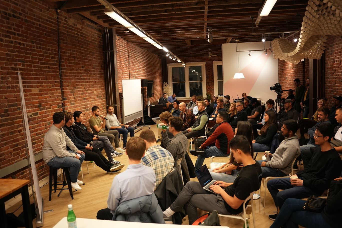 Chainlink + IoTeX event - Shot of room showing panelists and audience